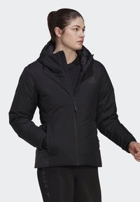 Black puffer jacket with a hood, made from smooth, waterproof material. Features zip closure and side pockets, with a subtle logo on the chest.