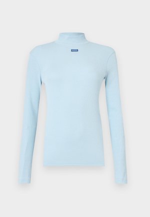 Light blue long-sleeve turtleneck top made of ribbed fabric, featuring a small blue logo on the chest and a fitted design.