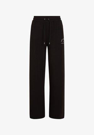 Pantalon de survêtement noir à coupe décontractée en tissu doux, avec une taille élastique munie d'un cordon de serrage et un petit logo sur le côté.