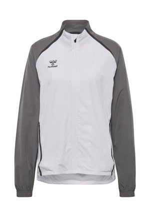 Giacca a vento bianca e grigia con colletto alto, zip frontale completa, polsini elasticizzati e logo Hummel sul lato sinistro del petto.