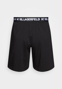 Shorts en coton noir avec une taille élastique portant le logo "KARL LAGERFELD" en blanc. Design simple, texture lisse et coupe ample.