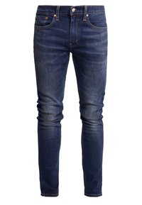 Jeans in denim blu scuro con vestibilità slim, dotati di tasche cucite e dettagli in metallo color rame, texture liscia e minimo scolorimento.