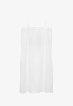 White slip dress with thin straps and lace trim along the neckline, hanging against a plain background.
