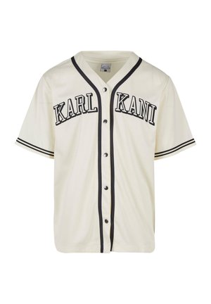 Kortærmet cremefarvet trøje i jersey med sort "KARL KANI" tekst, kontrastkanter, knaplukning og et klassisk baseballkrav.