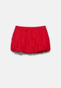 Jupe boule rouge à taille élastique avec ourlet froncé, réalisée en tissu léger, présentée sur fond uni.