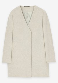 Beige oversized kappa med V-hals och trekvartslånga ärmar. Tillverkad av textil med struktur, med en öppen front och en slät innerfoder.