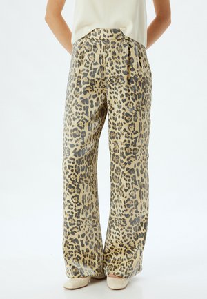 Beige weit geschnittene Hose mit Leopardenmuster in Schwarz- und Brauntönen, mit elastischem Bund und seitlichen Taschen. Glattes, strukturiertes Material.