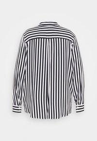 Zwart-wit gestreepte blouse met lange mouwen, achterpand, knoopmanchetten en een licht gebogen zoom. Soepele stofstructuur.