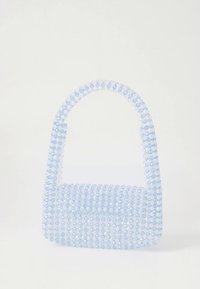 Light blue handbag made of transparent beads, featuring a structured design with a rounded handle and flat base, accented with shimmering facets.