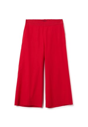Pantaloni larghi rossi con vita elastica, texture liscia e senza motivi o dettagli hardware visibili.