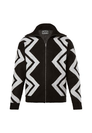 Schwarz-weißer Reißverschluss-Pullover mit Zickzackmuster, aus weichem Material, mit hohem Kragen und gerippten Bündchen.