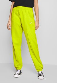 Nike Sportswear W NSW ESSNTL PANT FLC TREND - Calças de fato de treino - bright cactus/(white)