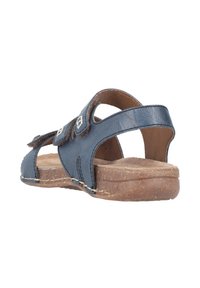 Navy leather sandal with cut-out design, adjustable straps, and a cork sole. Features a textured footbed and brown accents.