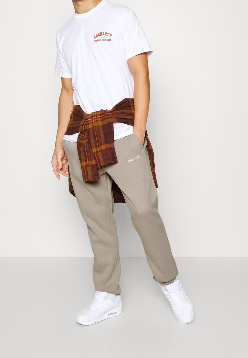 WRSTBHVR Träningsbyxor - beige