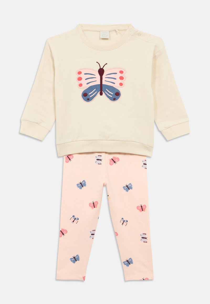 Cream sweatshirt with pink and blue butterfly applique, paired with light pink leggings featuring a butterfly print in various colors.