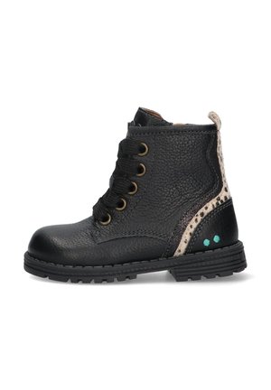 Black leather ankle boot with textured surface, five eyelets, and lace-up design. Features a spotted beige accent and teal dots on heel.