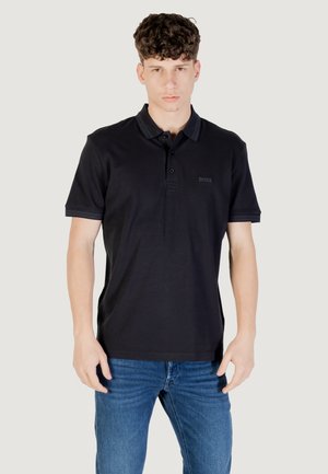 Polo shirt nero in cotone, con un'apertura a tre bottoni e un colletto e bordi delle maniche con dettagli a contrasto sottili. Logo del marchio sul petto.