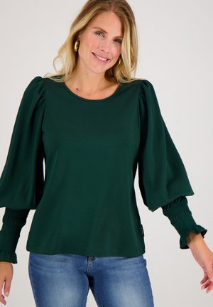 Groene top met lange mouwen, pofmouwen en gathered manchetten. Gemaakt van een zachte stof, met een ronde halslijn en een relaxed fit.