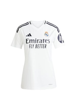 Maillot de football blanc avec des accents noirs, présentant un col en V, un design à trois rayures sur les épaules et le logo "Emirates Fly Better" sur le devant.