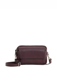 Burgundy crossbody bag made of textured synthetic material. Features a front flap, zippered compartments, and an adjustable strap. Silver hardware accents.