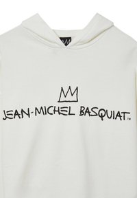 Felpa bianca con cappuccio caratterizzata da una stampa grafica nera con la scritta "JEAN-MICHEL BASQUIAT" e un'icona di corona sopra. Realizzata in materiale morbido con cappuccio regolabile.