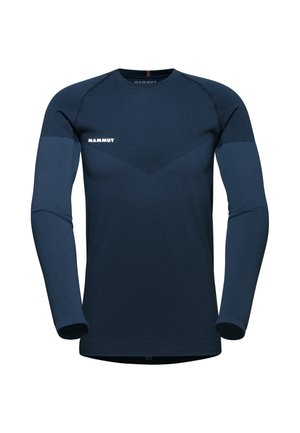 Langarm donkerblauw shirt van rekbaar materiaal. Kenmerkt zich door een gladde textuur, contrasterend paneelontwerp en wit logo op de borst.