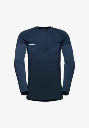 Langarm donkerblauw shirt van rekbaar materiaal. Kenmerkt zich door een gladde textuur, contrasterend paneelontwerp en wit logo op de borst.