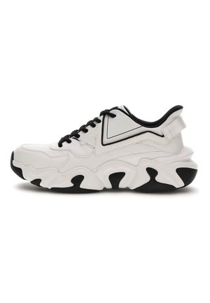 White and black chunky sneaker with thick sole, black laces, and loop on heel, side logo "GUESS" on smooth upper material.