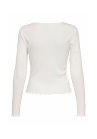 Biała, prążkowana koszulka z długimi rękawami, z falbaniastym wykończeniem rękawów i dolnej części, pokazana z tyłu.