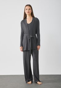 Grey loungewear set featuring a long-sleeve wrap cardigan with tie and wide-leg pants, made from soft fabric with a smooth texture.