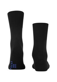 Ett par svarta ankelsockor med ribbad mudd, där den ena visar blå "FALKE RUN 39-41" text på sulan.