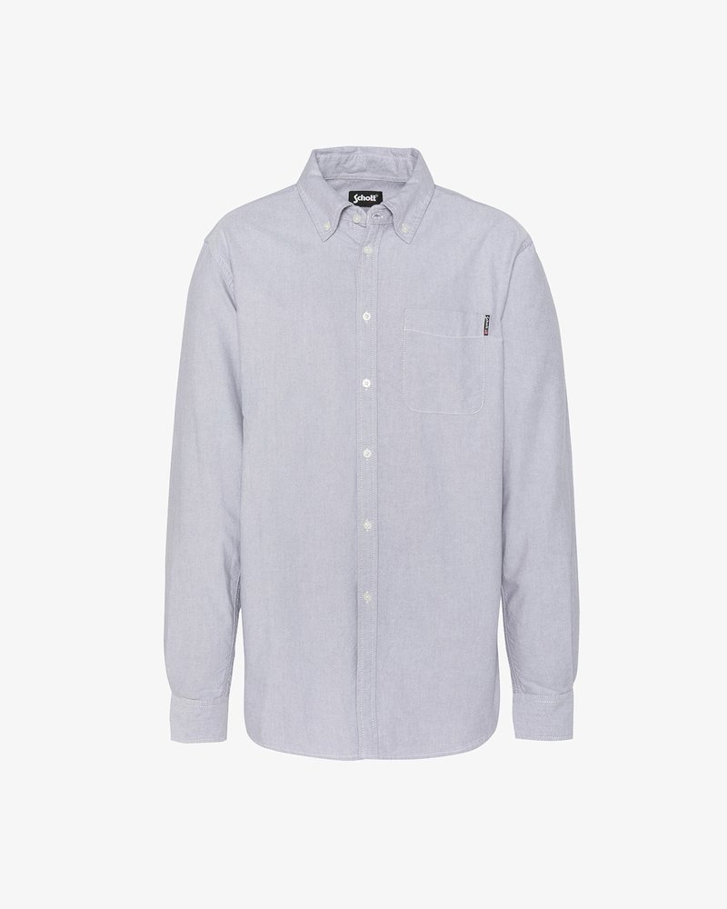 Lyseblå skjorte med knaplukning lavet af blødt stof. Har lange ærmer, en brystlomme og en let buet søm. Mærke synligt ved kraven.