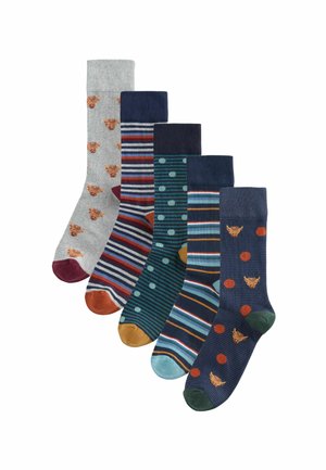 Five pairs of socks: grey with animal print, striped in multiple colors, dotted, blue with thin stripes, and dark green with polka dots.
