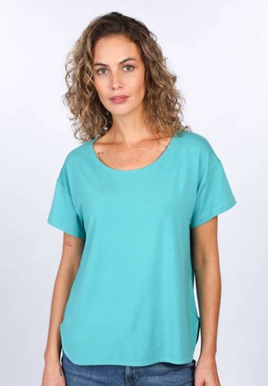 Türkises T-Shirt mit kurzen Ärmeln aus weichem Stoff, Rundhalsausschnitt und lockerer Passform mit seitlichen Schlitzen für mehr Bewegungsfreiheit.