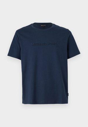 Navy blue cotton t-shirt with short sleeves and a crew neck; features a raised "MICHAEL KORS" logo on the front.