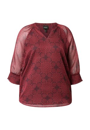 Blouse à motifs rouges avec des manches transparentes trois-quarts, des poignets smockés et un col en V.
