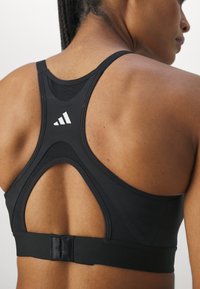 adidas Performance Vidēja atbalsta sporta krūšturis - black/white