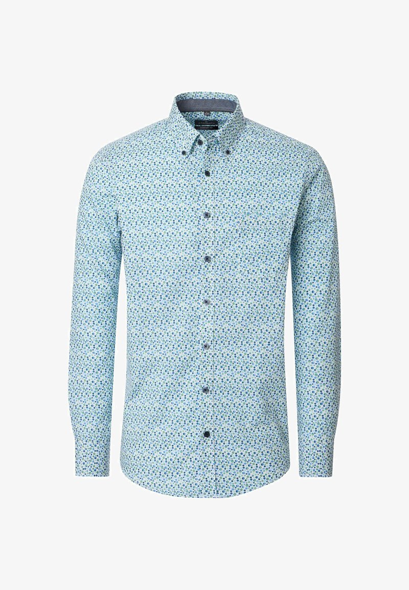 Lyseblå skjorte med knapper, lange ærmer og et mønster af små grønne og blå prikker med jævn afstand.