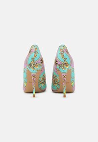 High-heeled shoes with a multicolored floral pattern, featuring a turquoise base and purple accents, smooth texture, and stiletto heels.
