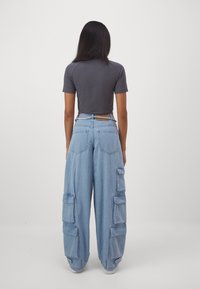 adidas Originals Široke nogavice - clear blue