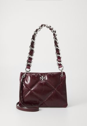 Quilted burgundy leather handbag with a silver chain and leather shoulder strap, featuring a decorative logo in the center.