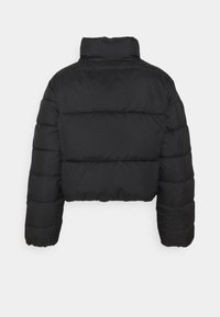 Black cropped puffer jacket with a high collar, quilted texture, and elasticized cuffs. Features a minimalist design with no visible hardware.