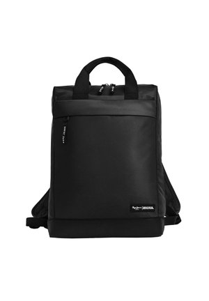 Black backpack made of durable fabric with a square shape; features two top handles, padded straps, a front pocket, and zip closures.