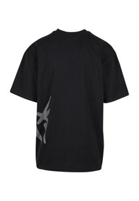 Black cotton t-shirt with short sleeves, featuring a large gray graphic design on the left side and a classic crew neck.