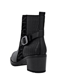 Remonte Bottines à plateau - schwarz