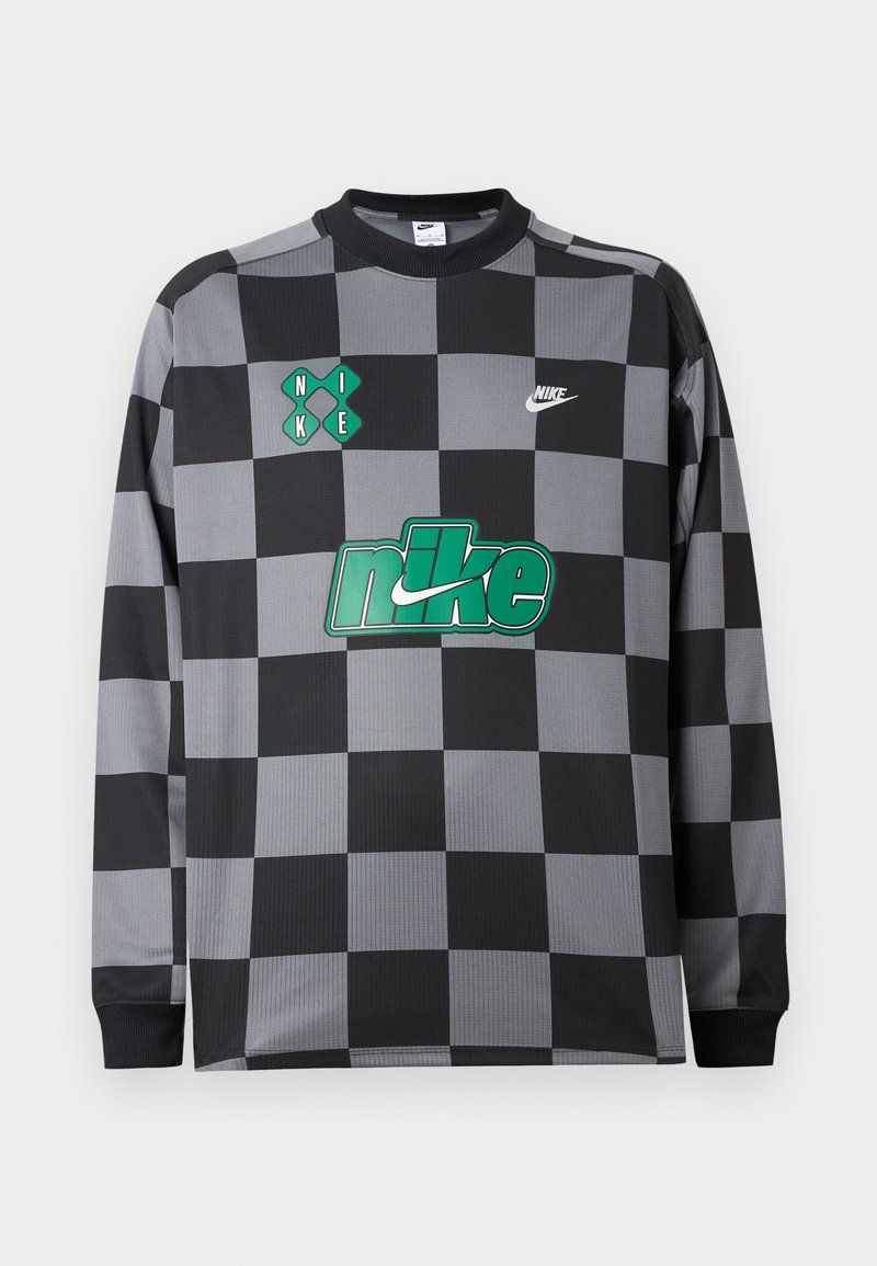 Langärmeliges Nike-Shirt mit schwarz-grauem Schachbrettmuster, grünem Nike-Logo auf der Brust, kleinen weißen und grünen Markendetails vorne.