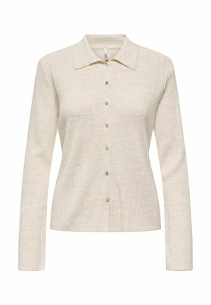 Chemise beige à manches longues avec un col, fermeture à boutons sur le devant, texture en relief verticale et subtile brillance.