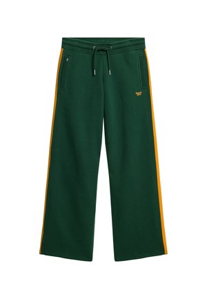 Pantalons de survêtement verts avec des jambes larges, bandes latérales orange, taille avec cordon de serrage et poches latérales. Présente un logo brodé en orange à l'avant.