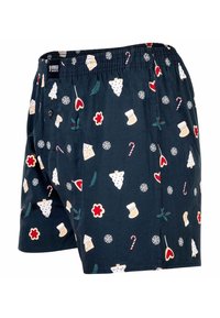 Boxershorts in marineblauwe stof met kleurrijke, vakantie-thema patronen, waaronder peperkoekhuisjes, sneeuwvlokken, zuurstokjes en bloemen.