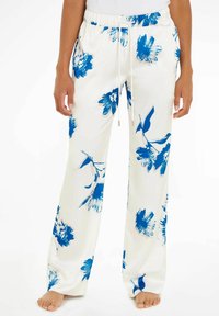 Pantaloni bianchi a fiori con un motivo floreale blu, cintura elastica, dettaglio con coulisse e design a gamba larga per una vestibilità rilassata.